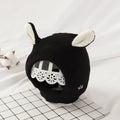 Red knitted animal ear dog hood with cream inner ears.